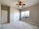 Spacious bedroom with double door closet and window at 5052 Haven Lodge Rd, Matthews, NC 28104