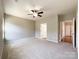 Spacious bedroom with ceiling fan and carpeting at 5052 Haven Lodge Rd, Matthews, NC 28104