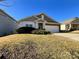 Single-story home with attached garage and landscaping at 5052 Haven Lodge Rd, Matthews, NC 28104