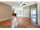 Open living room, kitchen, and breakfast area with hardwood floors at 5052 Haven Lodge Rd, Matthews, NC 28104