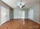 Spacious living room with hardwood floors and neutral walls at 5052 Haven Lodge Rd, Matthews, NC 28104