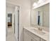 Bathroom featuring a vanity, large mirror, and doorway into bedroom space at 5057 Spratt Rd, York, SC 29745