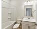 Bright bathroom featuring a single sink vanity with white countertop, mirror and bath tub at 5057 Spratt Rd, York, SC 29745