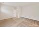 Spacious bedroom with neutral carpeting and paint, featuring a doorway to an adjoining room at 5057 Spratt Rd, York, SC 29745