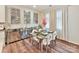 Dining room featuring a glass dining table, decorative wall art, and cream-colored curtains at 5057 Spratt Rd, York, SC 29745