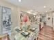 Bright dining area with modern glass table and decor, next to the contemporary kitchen at 5057 Spratt Rd, York, SC 29745