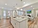 Bright kitchen showcasing an island with seating, open to the living and dining areas at 5057 Spratt Rd, York, SC 29745