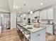 Spacious kitchen island with seating, modern pendant lighting, and plenty of counter space at 5057 Spratt Rd, York, SC 29745