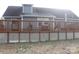 Wide back deck of a home features wood railings and white lattice offering a relaxing outdoor space at 517 Grassy Creek Run, Chester, SC 29706
