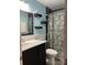 Clean bathroom with dark vanity and a floral shower curtain at 517 Grassy Creek Run, Chester, SC 29706