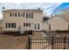 The backyard features a dining area, a grill and a well-kept lawn, perfect for outdoor entertaining at 523 Fence Post Ln, Matthews, NC 28105