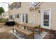 Backyard patio with outdoor dining area and exterior view of the home at 523 Fence Post Ln, Matthews, NC 28105