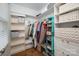 Walk-in closet with shelving and storage compartments for clothes and shoes at 523 Fence Post Ln, Matthews, NC 28105