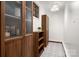 Hallway features built-in shelving, patterned flooring, and elegant lighting fixtures that offers a blend of style and functionality at 523 Fence Post Ln, Matthews, NC 28105