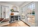 Bright kitchen with white walls, gray accents, hardwood flooring, and outdoor access at 523 Fence Post Ln, Matthews, NC 28105