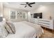 Spacious main bedroom with a ceiling fan and plenty of natural light offers a comfortable and inviting atmosphere at 523 Fence Post Ln, Matthews, NC 28105