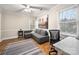 Office space with a gray sofa, desk, and natural light from the window at 523 Fence Post Ln, Matthews, NC 28105