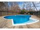 Backyard pool surrounded by a concrete patio and a fenced-in yard at 523 Fence Post Ln, Matthews, NC 28105