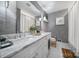 Updated bathroom with double vanity, marble countertop, and gray textured walls at 6737 Lancer Dr, Charlotte, NC 28226