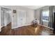 Bright bedroom with hardwood floors and a closet with louvered doors at 6737 Lancer Dr, Charlotte, NC 28226