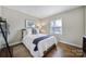 Cozy bedroom with hardwood floors and a neutral color palette at 6737 Lancer Dr, Charlotte, NC 28226