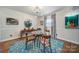 Mid-century modern dining room with hardwood floors and stylish light fixture at 6737 Lancer Dr, Charlotte, NC 28226