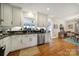 Modern kitchen with white cabinets, granite countertops, and stainless steel appliances at 6737 Lancer Dr, Charlotte, NC 28226