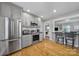 Kitchen with stainless steel appliances and gray cabinets at 6737 Lancer Dr, Charlotte, NC 28226