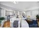 Living room with white sofas and a view into the kitchen at 6737 Lancer Dr, Charlotte, NC 28226