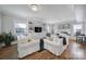 Spacious living room featuring built-in shelving and a fireplace at 6737 Lancer Dr, Charlotte, NC 28226