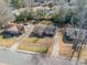 Aerial view showcasing a house's location within a residential area at 6816 Idlewild Rd, Charlotte, NC 28212