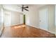 Well-lit bedroom with hardwood floors and an ensuite bathroom at 6816 Idlewild Rd, Charlotte, NC 28212