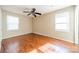 Spacious bedroom with hardwood floors and large windows at 6816 Idlewild Rd, Charlotte, NC 28212