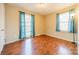 Bedroom with hardwood floors and teal curtains at 6816 Idlewild Rd, Charlotte, NC 28212