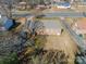 Backyard view of a brick ranch house at 6816 Idlewild Rd, Charlotte, NC 28212