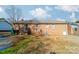 Brick ranch house with deck, and a yard at 6816 Idlewild Rd, Charlotte, NC 28212