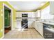 Bright kitchen with white cabinets and granite countertops at 6816 Idlewild Rd, Charlotte, NC 28212