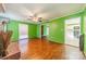 Living area with hardwood floors and view into kitchen at 6816 Idlewild Rd, Charlotte, NC 28212