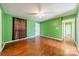 Spacious living room with hardwood floors and green walls at 6816 Idlewild Rd, Charlotte, NC 28212