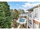 Community pool with lake views and surrounding deck at 7844 Village Harbor Dr # 36, Cornelius, NC 28031