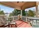 Private balcony with wooden deck, lake views, and seating at 7844 Village Harbor Dr # 36, Cornelius, NC 28031