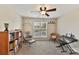 Bright bedroom with window, ceiling fan, and ample book shelving at 7844 Village Harbor Dr, Cornelius, NC 28031