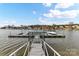 Community boat dock with multiple slips and lake access at 7844 Village Harbor Dr # 36, Cornelius, NC 28031