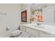 Clean bathroom with white vanity and floral shower curtain at 804 Skybrook Falls Dr, Huntersville, NC 28078