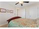 Bright bedroom with wood bed frame and patterned bedding at 804 Skybrook Falls Dr, Huntersville, NC 28078