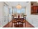 Bright dining area with wood floors and charming table setting at 804 Skybrook Falls Dr, Huntersville, NC 28078