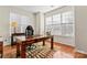 Spacious home office with large desk and wood floors at 804 Skybrook Falls Dr, Huntersville, NC 28078