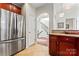 Kitchen boasts stainless steel fridge and view of staircase at 804 Skybrook Falls Dr, Huntersville, NC 28078