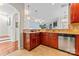 Kitchen with island, stainless steel dishwasher, and wood cabinets at 804 Skybrook Falls Dr, Huntersville, NC 28078