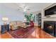 Bright living room featuring hardwood floors, fireplace and large windows at 804 Skybrook Falls Dr, Huntersville, NC 28078